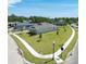 Exterior aerial view of a home with a well-maintained lawn and landscaping at 4056 Southern Valley Loop, Brooksville, FL 34601
