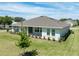 Beautifully landscaped home showcasing manicured lawns, a symmetrical design, and a serene residential setting at 4056 Southern Valley Loop, Brooksville, FL 34601