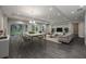 Bright living room features hardwood floors, ample natural light, modern decor, and a dining area at 4056 Southern Valley Loop, Brooksville, FL 34601