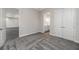 Spacious room with plush carpeting, featuring doorways leading to additional living spaces and bathroom at 4056 Southern Valley Loop, Brooksville, FL 34601