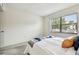 Comfortable bedroom featuring a window, plush carpet, and neutral decor at 413 Meadow Ln # 81, Oldsmar, FL 34677