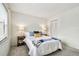 Bright bedroom with comfortable queen bed, a walk-in closet and two side tables with matching lamps at 413 Meadow Ln # 81, Oldsmar, FL 34677