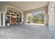 Wide entrance and foyer featuring light stone pillars and stone floors and a golf course view at 413 Meadow Ln # 81, Oldsmar, FL 34677