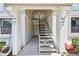 Exterior entrance featuring well-maintained stairs with an outside entry to the units at 413 Meadow Ln # 81, Oldsmar, FL 34677
