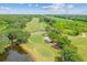 Beautiful aerial view of the meticulously maintained golf course with mature trees and water features at 413 Meadow Ln # 81, Oldsmar, FL 34677