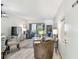 Sun-filled living room with comfortable furniture, modern décor, and sliding glass doors at 413 Meadow Ln # 81, Oldsmar, FL 34677