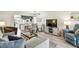 Open-concept layout connects living room, dining area, and kitchen seamlessly at 413 Meadow Ln # 81, Oldsmar, FL 34677