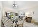 Inviting living room featuring a dining area, comfortable seating, and sliding glass doors to outdoor area at 413 Meadow Ln # 81, Oldsmar, FL 34677