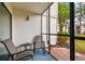 Relaxing screened patio featuring comfortable seating, perfect for enjoying the outdoors at 413 Meadow Ln # 81, Oldsmar, FL 34677