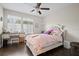 Charming bedroom with a comfortable bed, stylish desk, and soft natural light creating a serene atmosphere at 4264 Bexley Village Dr, Land O Lakes, FL 34638
