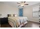 Cozy bedroom with a unique climbing wall feature, complemented by a comfortable bed and ceiling fan at 4264 Bexley Village Dr, Land O Lakes, FL 34638