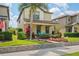 Charming home with landscaped front yard, inviting porch, and attractive curb appeal at 4264 Bexley Village Dr, Land O Lakes, FL 34638