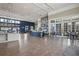 Bright open interior view with tile floors, large windows, and a modern Twisted Sprocket Cafe perfect for gatherings at 4264 Bexley Village Dr, Land O Lakes, FL 34638