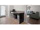 Functional mudroom with built-in desk, storage cabinets, and access to the living area at 4264 Bexley Village Dr, Land O Lakes, FL 34638