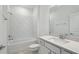 Bathroom featuring a tub, shower with white subway tile, and a modern vanity at 4303 Big Sky Dr, Spring Hill, FL 34604