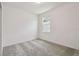 Bright bedroom with a window and neutral carpet, ready for personalization at 4303 Big Sky Dr, Spring Hill, FL 34604
