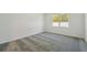 Neutral bedroom with cozy carpet and natural light streaming through the window at 4303 Big Sky Dr, Spring Hill, FL 34604