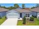 Charming single-story home with a well-manicured lawn and an attached two-car garage at 4303 Big Sky Dr, Spring Hill, FL 34604