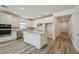 Bright kitchen featuring white cabinets, stainless steel appliances, and a center island at 4303 Big Sky Dr, Spring Hill, FL 34604