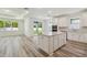 Open-concept kitchen seamlessly connects to the living and dining areas, with outside access at 4303 Big Sky Dr, Spring Hill, FL 34604