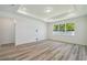 Spacious room features new plank flooring and modern recessed lighting at 4303 Big Sky Dr, Spring Hill, FL 34604