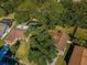 Aerial view of homes in a residential area with mature trees and well-maintained yards at 455 Cypress Lake Ct, Oldsmar, FL 34677