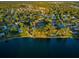 Aerial view of a community featuring a tennis court and lake access, perfect for active residents at 455 Cypress Lake Ct, Oldsmar, FL 34677