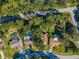 Aerial view of a residential area showcasing homes with well-maintained yards and mature trees at 455 Cypress Lake Ct, Oldsmar, FL 34677
