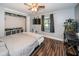Well-lit bedroom featuring a closet and window view, complete with desk and fish tank at 455 Cypress Lake Ct, Oldsmar, FL 34677
