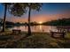 Picturesque lake view with benches offering a tranquil spot to relax and enjoy nature at 455 Cypress Lake Ct, Oldsmar, FL 34677
