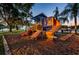 Community playground offers climbing and sliding activities at 455 Cypress Lake Ct, Oldsmar, FL 34677