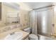 Bathroom with a sink, toilet and tub/shower combo with shower curtain at 4609 10Th Street E Ct, Ellenton, FL 34222