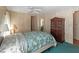 Bedroom with vintage furnishings, ceiling fan, closet, and carpet at 4609 10Th Street E Ct, Ellenton, FL 34222