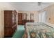 Vintage bedroom with dark wood furniture and seashell-themed bedspread at 4609 10Th Street E Ct, Ellenton, FL 34222