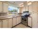 The home has a functional kitchen with modern appliances and abundant counter space at 4609 10Th Street E Ct, Ellenton, FL 34222