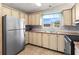 A well-lit kitchen features stainless steel appliances and ample cabinet space at 4609 10Th Street E Ct, Ellenton, FL 34222