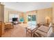 The living room is bright and spacious with sliding glass doors to the back deck at 4609 10Th Street E Ct, Ellenton, FL 34222