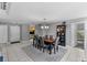 Open dining area with a modern chandelier and a view of the adjacent kitchen at 5032 Cypress Trace Dr, Tampa, FL 33624
