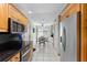 The kitchen boasts wood cabinets, black countertops, and stainless steel appliances at 5032 Cypress Trace Dr, Tampa, FL 33624