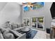 Cozy living room with large windows and sliding glass doors leading to the pool area at 5032 Cypress Trace Dr, Tampa, FL 33624