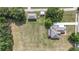 Aerial view of the home on large lot featuring mature landscaping and a long driveway at 5319 W Trapnell Rd, Dover, FL 33527