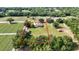 Aerial view of property bordered in red, surrounded by farmland and mature trees at 5319 W Trapnell Rd, Dover, FL 33527