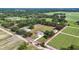 Aerial view of property bordered in red, surrounded by farmland and mature trees at 5319 W Trapnell Rd, Dover, FL 33527