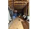 Unfinished attic space, good for storage, showing roof structure, floor, and utilities at 5319 W Trapnell Rd, Dover, FL 33527