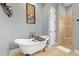 Serene bathroom featuring a standalone tub and a step-in shower at 5319 W Trapnell Rd, Dover, FL 33527