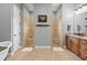 Luxurious bathroom showcasing dual walk-in showers and a granite countertop vanity at 5319 W Trapnell Rd, Dover, FL 33527