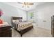 Comfortable bedroom with a ceiling fan, window seat, and carpeted floors at 5319 W Trapnell Rd, Dover, FL 33527