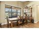 Inviting dining area featuring a wooden table, ample seating, and natural light, perfect for Gathering meals at 5319 W Trapnell Rd, Dover, FL 33527