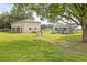 Detached garage with attached storage shed, perfect for tools and equipment at 5319 W Trapnell Rd, Dover, FL 33527