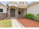 Charming home entrance with double doors, stone accents, and well-manicured landscaping at 5319 W Trapnell Rd, Dover, FL 33527